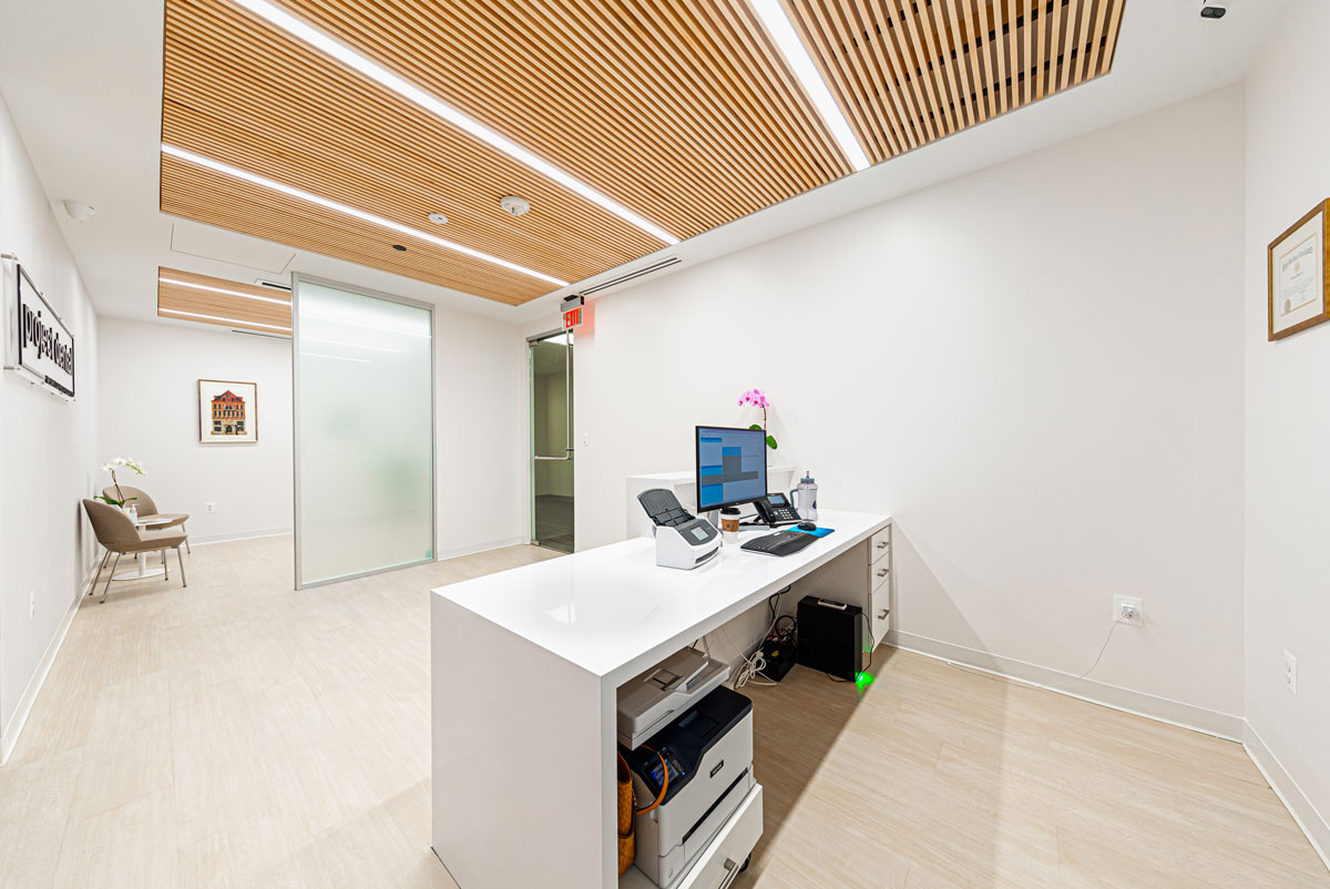 Project Dental sleek reception desk with computer and printer in Rockville, MD